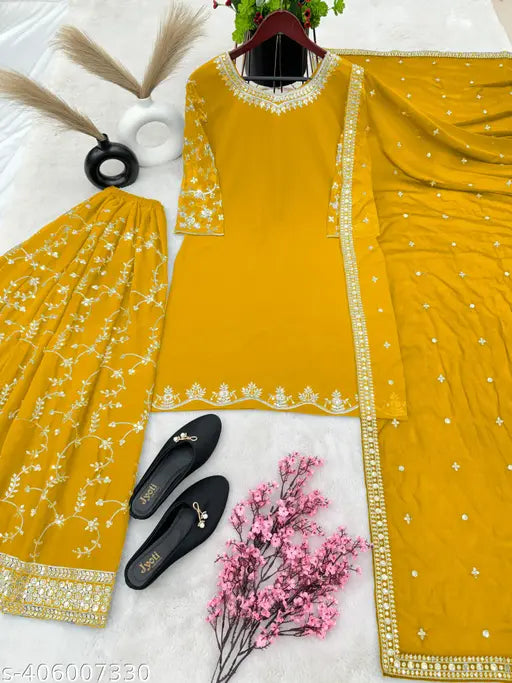 Yellow georgette outfit with embellishments, matching footwear