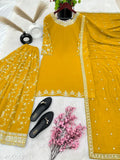 Yellow georgette outfit with embellishments, matching footwear