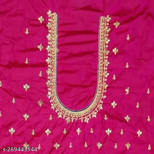 A stylish women's blouse with a round neckline, adorned with intricate embroidery