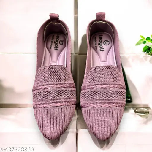 Pink velvet slippers with a white sole, flat shoe style