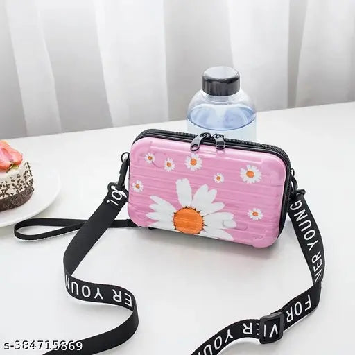 Pink slingbox with white floral pattern, adjustable strap