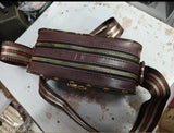 Trendy womens sling bag with brown leather and gold zippers