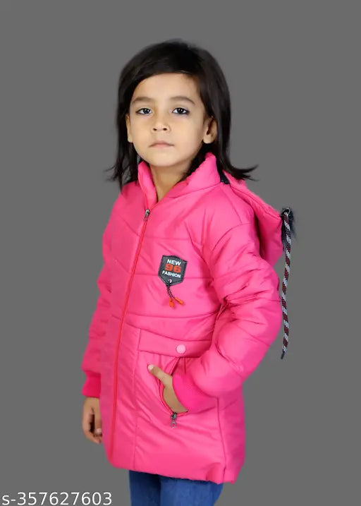 A young girl wearing a pink puffer jacket
