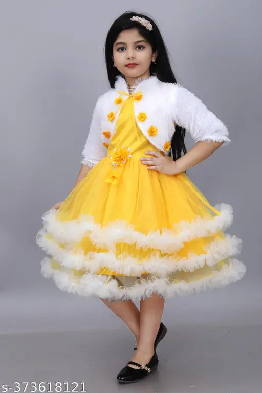 Green three-quarter sleeve Barbie girls festive wedding dress by Jhilik Garments, net fabric with printed pattern on display
