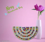 Multicolored round clutch with a beaded border and a shiny finish