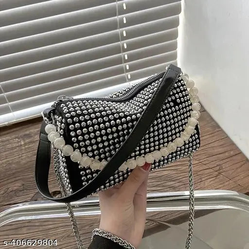 Silver rhinestone embellishments, black leather sling bag with chain strap, pearl handle, evening clutch purse