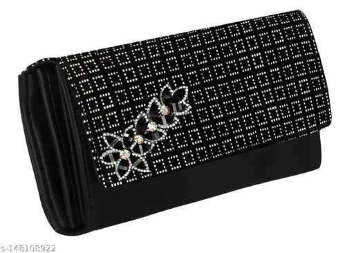 Black embroidered clutch with decorative hardware and a chain strap