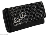 Black embroidered clutch with decorative hardware and a chain strap