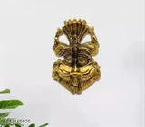 Metal wall hanging with Chandra Art Collection design, depicting a face of Narsingh and possibly Mahakal or Nazar Battu, 16 cm in size