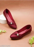 A burgundy bellie flat with bow detailing