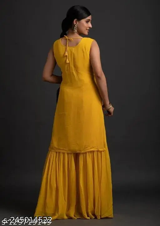 Yellow kameez with ruffled hems and traditional embroidery