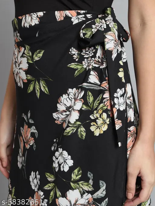 Floral black printed net maxi wrap skirt for women's wear, suitable for casual and formal occasions. Easy to match with various tops for spring, summer, and autumn seasons. Crepe material, size options available from S-XXL