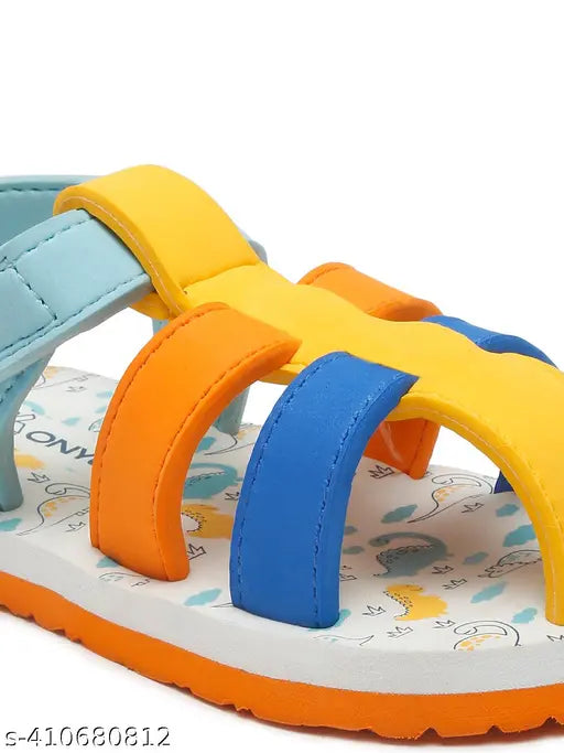 Multi-colored dinosaur sandal with multiple straps, velcro closures and a fun design