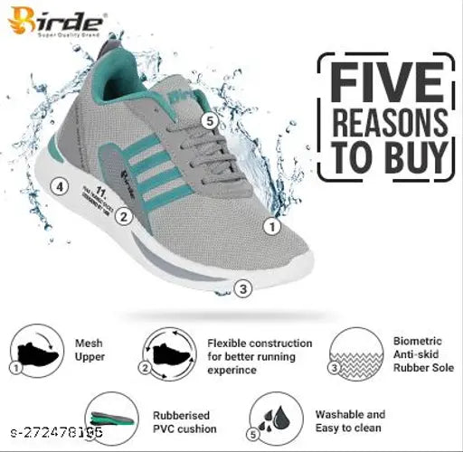 Gray and blue sports shoe with white accents, lace-up front, black rubber sole with small studs, designed for walking and comfort, suitable for kids