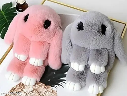 Pink and grey plush toy combo in a white ceramic jar
