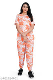 Orange cotton-blend co-ord set, featuring a printed T-shirt top and trouser pants in a traditional design. High-quality crepe fabric ensures comfort and style for women's summer or winter wear. Made in India