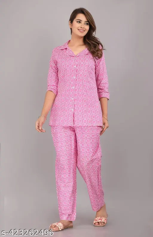 Pink cotton printed night suit set by Pragya Textile, featuring loose-fitting pyjamas with 3/4 sleeves and a charming floral print. Made from breathable cotton fabric for ultimate comfort during sleep or lounging