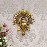 Metal Ganesh idol with Surya Chakra, brass finish and antique gold plating, traditional Indian decorative showpiece for worship or home décor, measures 23cm H x 18cm W x 3cm D