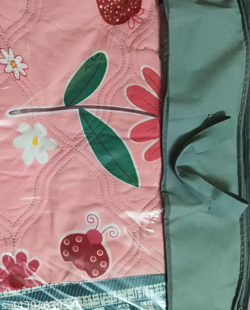 Reversible double bed quilt with green and pink floral pattern, bag packing included
