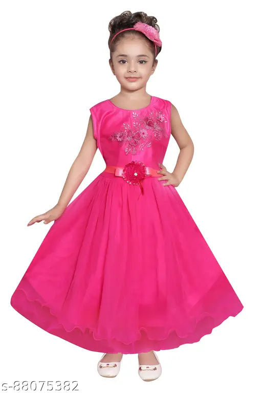 A pink ruffled princess frock gown dress with floral decoration