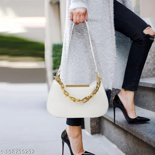 White leather sling bag with gold chain embellishment