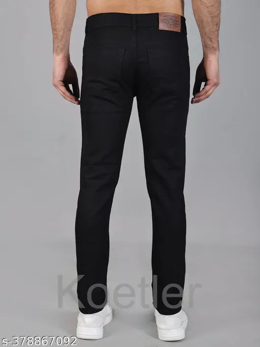 Stretchable men's black denim jeans, slim fit, mid rise, button closure, full length - ideal for casual wear. Sizes: 28", 30", 32" (inseam 40"). Made in India