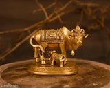 Handmade brass Kamdhenu Nandi cow statue with golden finish, symbolizing prosperity and Vatsalya (motherly love)