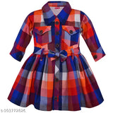 This is a charming multicolored dress in shades of blue, red, green, and yellow, adorned with contrasting white piping details. It features a collared neckline, adding a touch of elegance, and is fastened with a cute little bow tie at the waistband. The dress has a vibrant kraft background and could be made from cotton material