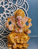 Golden Ganesha idol, eco-friendly poly resin, Hindu God for house temple or car dashboard, 8x6x14.5cm, symbolizes prosperity & positive energy