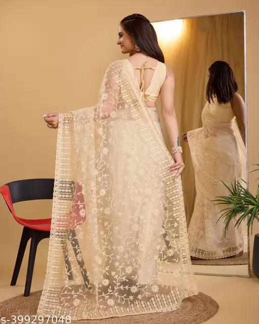 Embroidered net saree with running blouse in free size, refined Charvi design on premium super net fabric from India