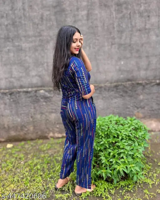 Women's rayon printed casual jumpsuit with three-quarter sleeves, available in S, M, L, XL, XXL. Vibrant print design offers an elegant touch to any outfit, making it versatile for various occasions. Indian origin