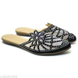 Synthetic black canvas embellished slip-on jutti for women, comfortable and stylish design. India-origin trendy flat boots with unique straps, suitable for everyday wear (IND-3 to IND-7 sizes available)