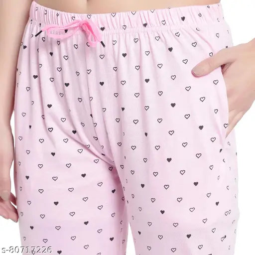 Pink cotton pants with heart pattern
