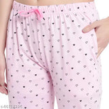 Pink cotton pants with heart pattern