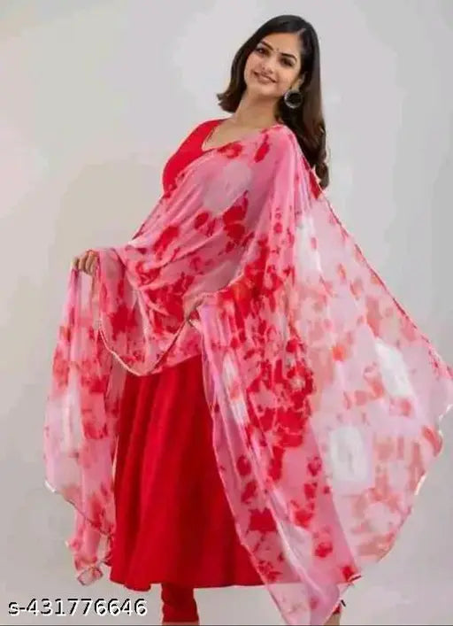 Red rayon kurta with stitched net dupatta and nylon bottomwear, solid pattern, three-quarter sleeves, Indian traditional clothing on display