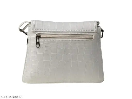 White sling bag with silver zippers and straps