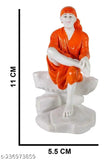 White poly resin Sai Baba idol for car dashboard or home decor (4.5" orange), handcrafted by skilled artisans, symbolizes spirituality and brings wealth, health, peace, and happiness in Vastu-compliant spaces. Great gifting option for special occasions. Made in India