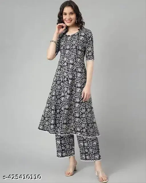 Art Silk and Rayon Viscose Jivika Drishya Women's Kurta Set with Palazzos, printed net, short sleeves, single size available. Indian-made fashion on model