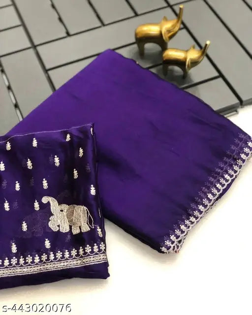 Purple georgette saree with elephant pattern and white border