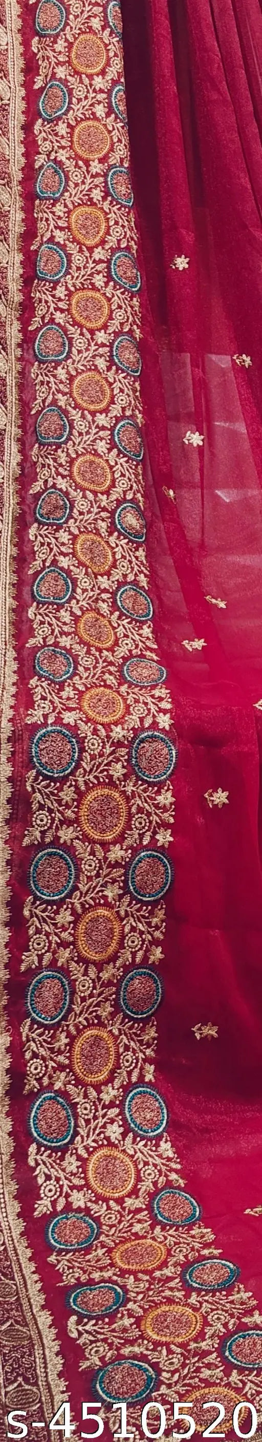 Embroidered paisley pattern on red fabric, likely silk or chiffon, with intricate floral designs and geometric patterns