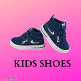 Kids' hiking shoes in navy blue with Nike swoosh and white sole, black laces