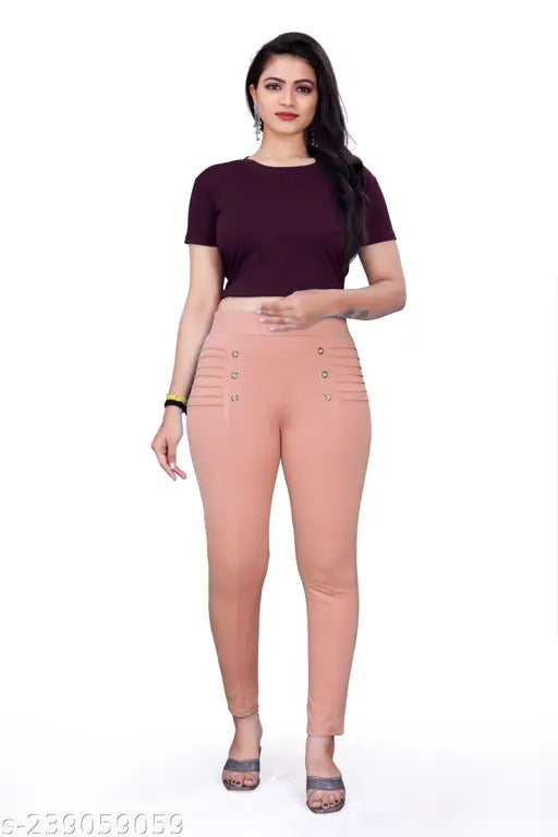 Pink cotton lycra jeggings for women, skin-fit and pleated front with steel button detail, ankle length, mid rise, stretchy and comfortable