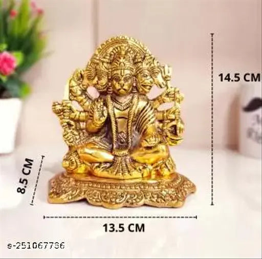 Yellow metal statue of Hindu deity Hanuman, sitting in meditative pose with four arms holding objects symbolic of devotion, courage, and wisdom. The statue is adorned with traditional attire and a serene expression