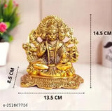 Yellow metal statue of Hindu deity Hanuman, sitting in meditative pose with four arms holding objects symbolic of devotion, courage, and wisdom. The statue is adorned with traditional attire and a serene expression