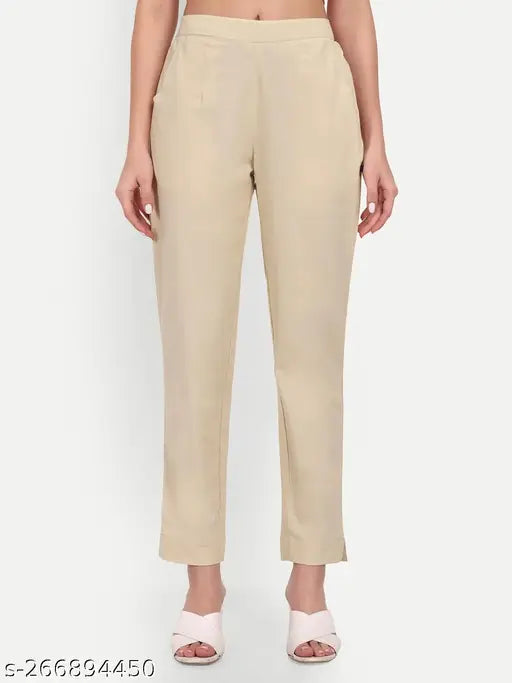 Beige solid cotton pants with half elastic waistband and two pockets, sizes ranging from 46 (waist 40in, length 39in, hip 52in) to XXL (waist 37in, length 39in, hip 49in), made in India