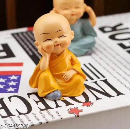 Small figurines of Buddha monks sitting in a row