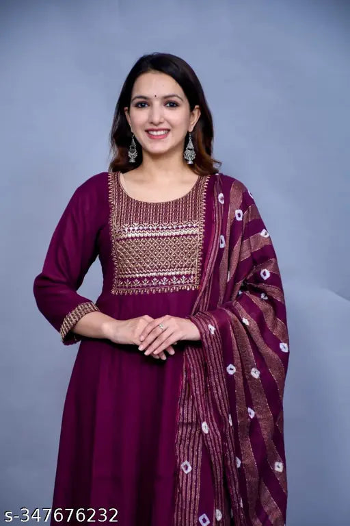 Purple rayon yug with zari woven net, Rayon inner and bottom fabric, cotton cambric dupatta. Indian traditional attire available in various sizes from M to 6XL