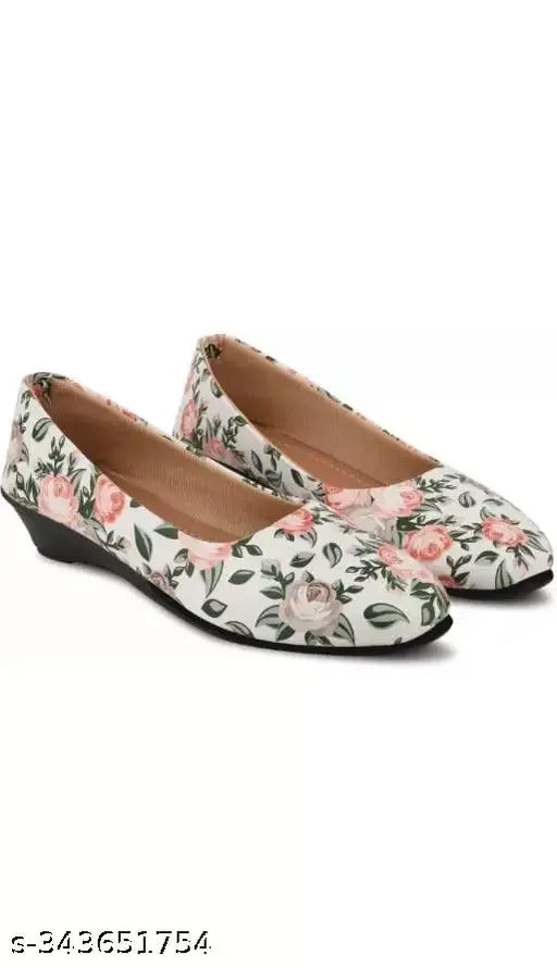 White synthetic ballerinas with printed design from imporio Fashion Hub. Comfortable slip-on shoes offering a stylish, attractive look in India sizes IND-3 to IND-8