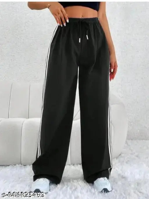 Black jogging pants with white stripes, black drawstring waistband