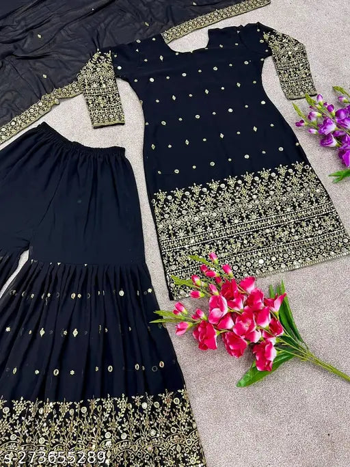 Black and gold embroidered outfit, featuring a matching dress and dupatta set. Comprises of a black long-sleeved dress with an embellished neckline and a matching dupatta, adorned with gold thread work